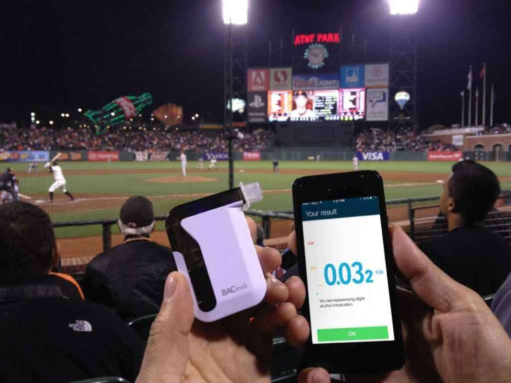 The BACtrack Mobile Pro smartphone breathalyser being used during a baseball game