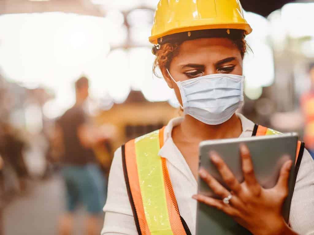 A staff of a construction company looking at a tablet