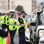 Police inspecting vehicles for alcohol impairment