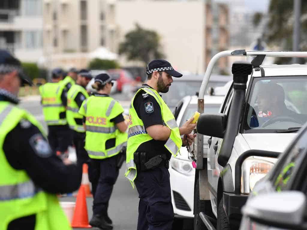 Police inspecting vehicles for alcohol impairment