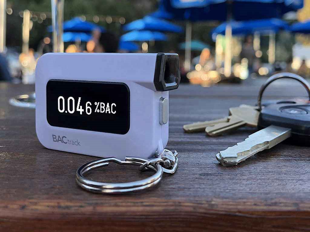 Keychain alcohol breath tester showing the BAC result