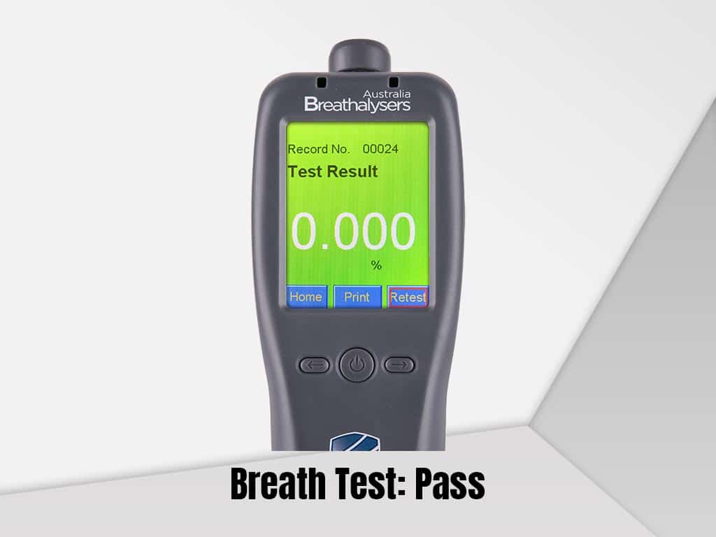 A workplace breathalyser showing a Pass result.