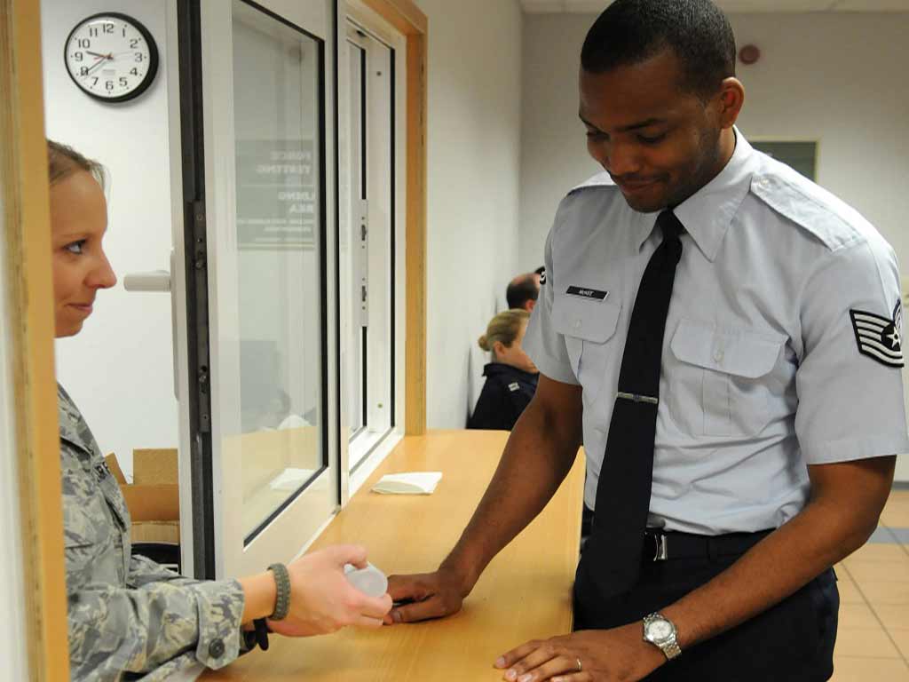 A uniformed personnel getting a urine test