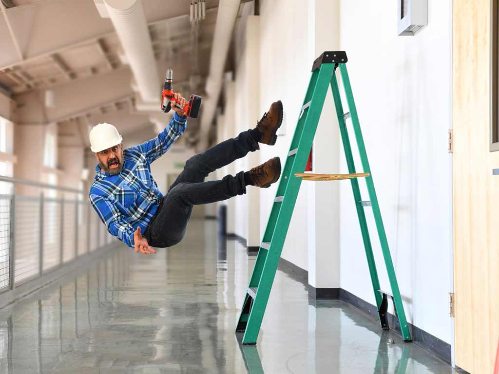 A man falling off a ladder at work