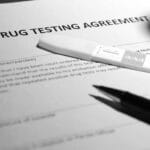 A drug testing agreement form and a compact testing kit