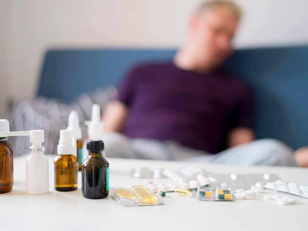 A man sleeping after taking many pills