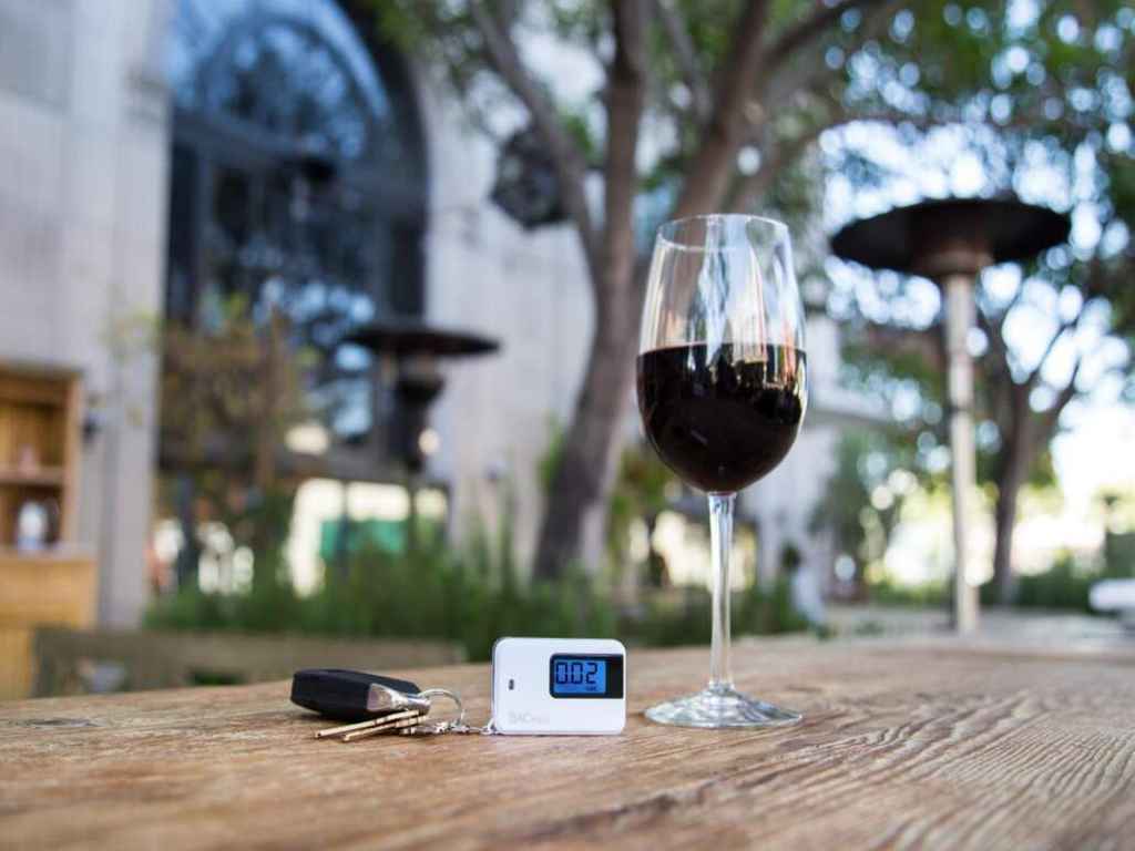 BACtrack keychain breathalyser and a glass of wine